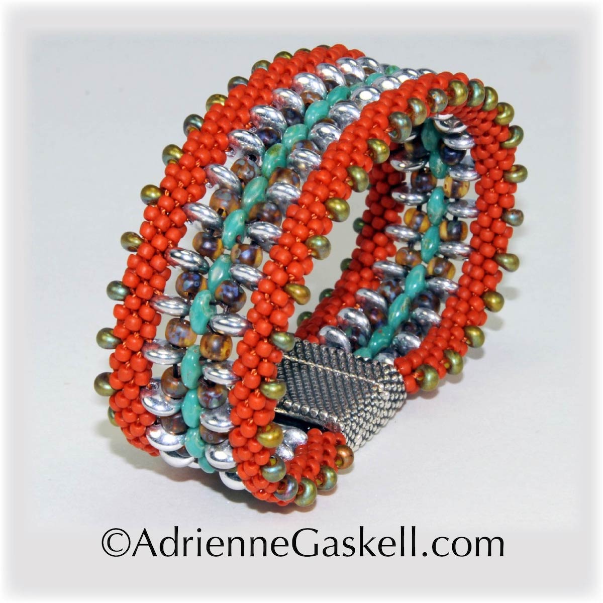 This project was featured in Bead & Button Magazine as Elegant Ombre Braids, December 2019. This bracelet achieves dimensional impact by stacking and then joining three separate braids together. Czech teardrop beads with a rainbow AB finish are the crowning glory.