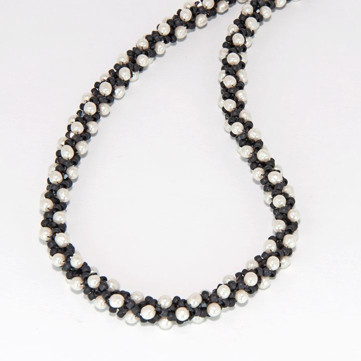 This lesson covers how to braid a pearl beaded necklace.